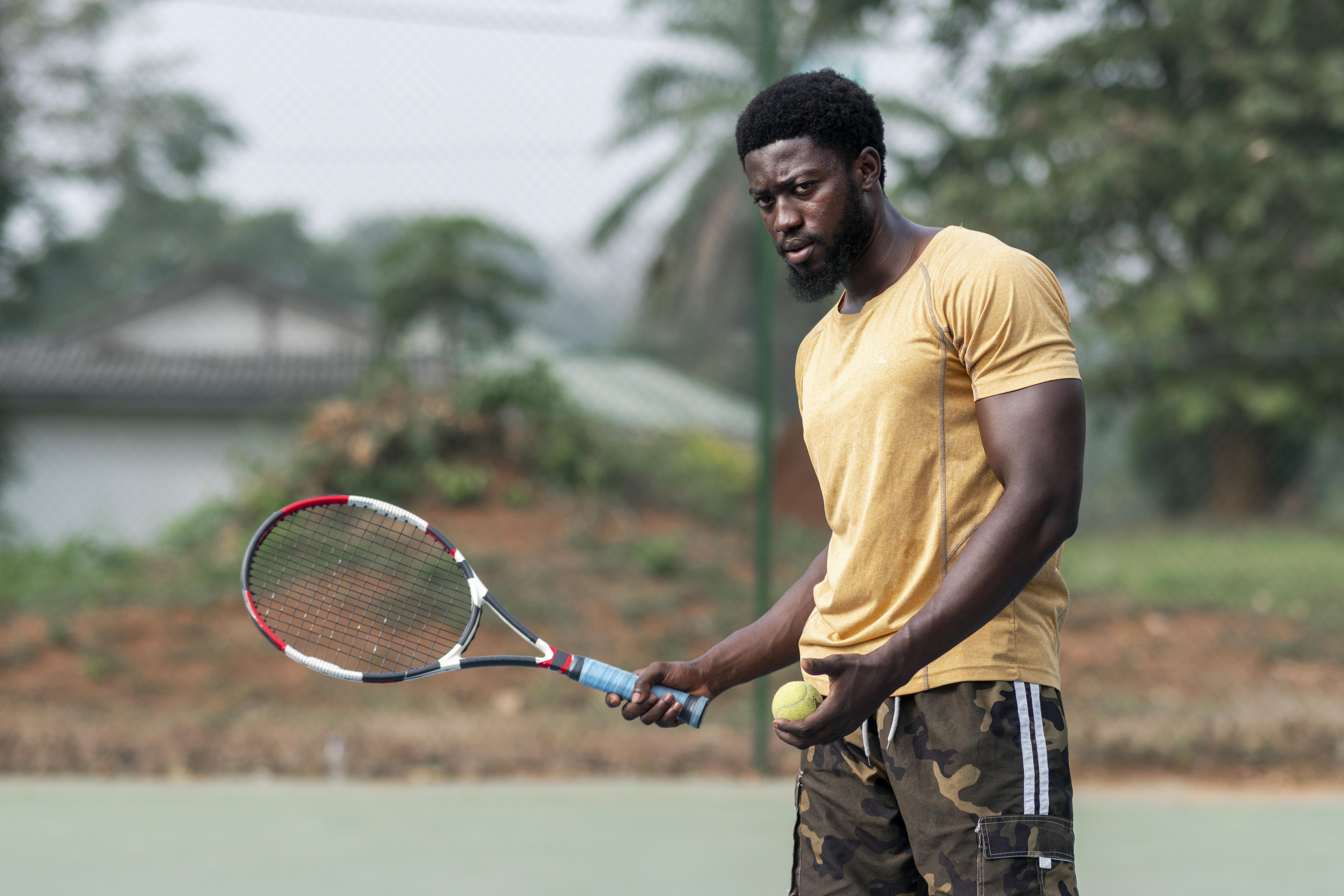 young-man-tennis-court-playing.jpg